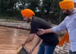Why are Sikhs putting prashad and other things in the flood waters?